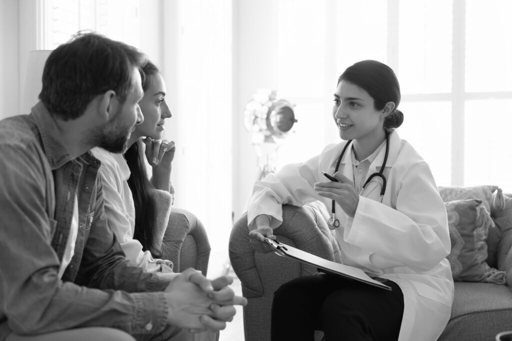 Intended parents speaking with a fertility specialist