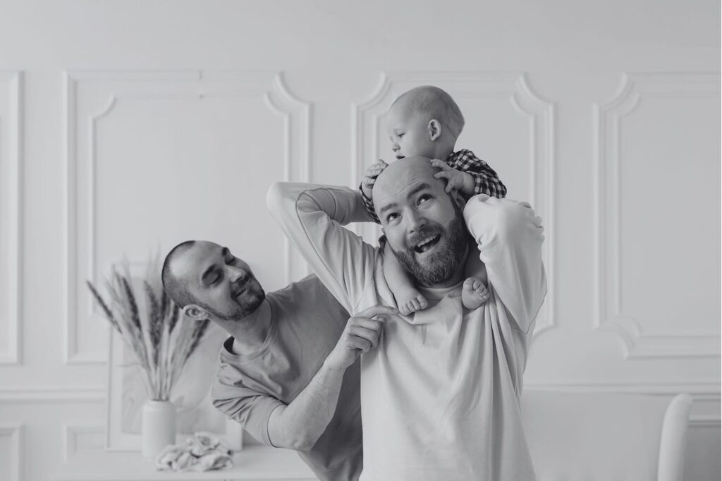 Happy parents with their baby, representing a successful journey with surrogacy abroad