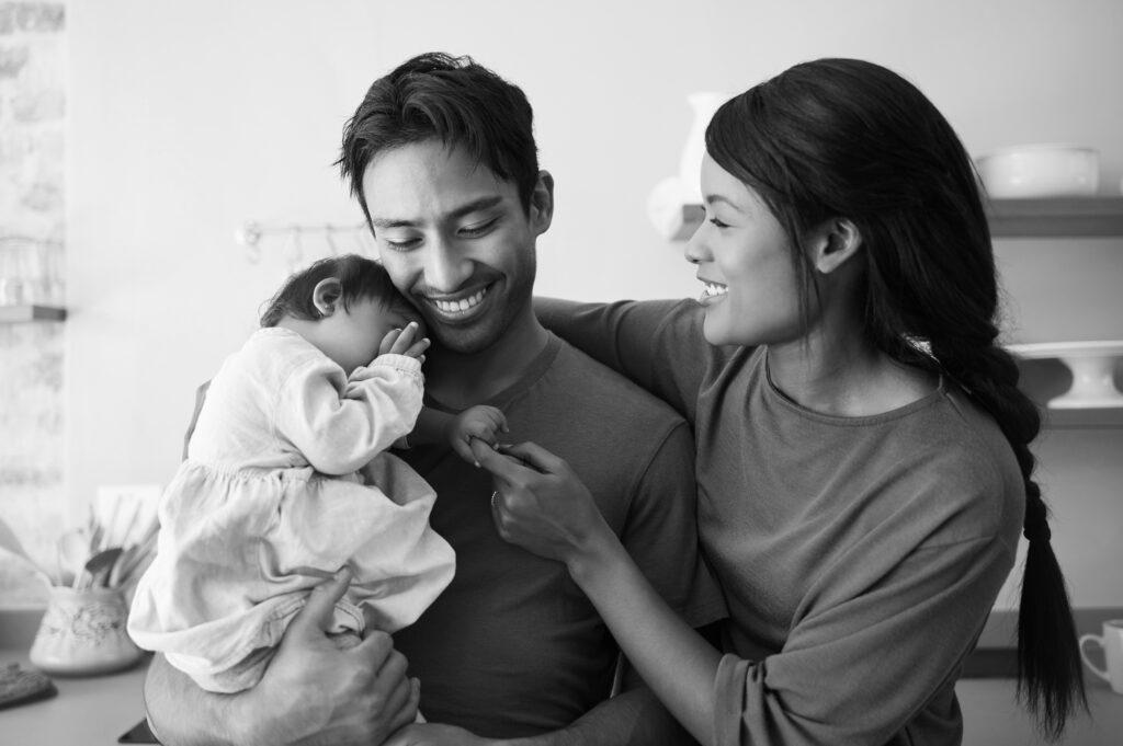 Happy parents with their baby, symbolizing the outcome of a successful cryo transport and IVF journey