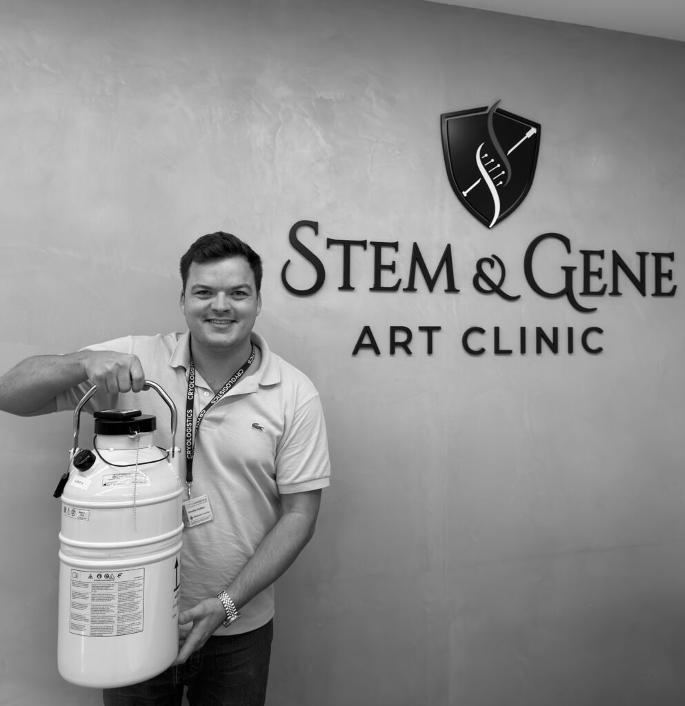 CryoLogistics courier holding a cryoshipper at a fertility clinic used for transporting frozen embryos