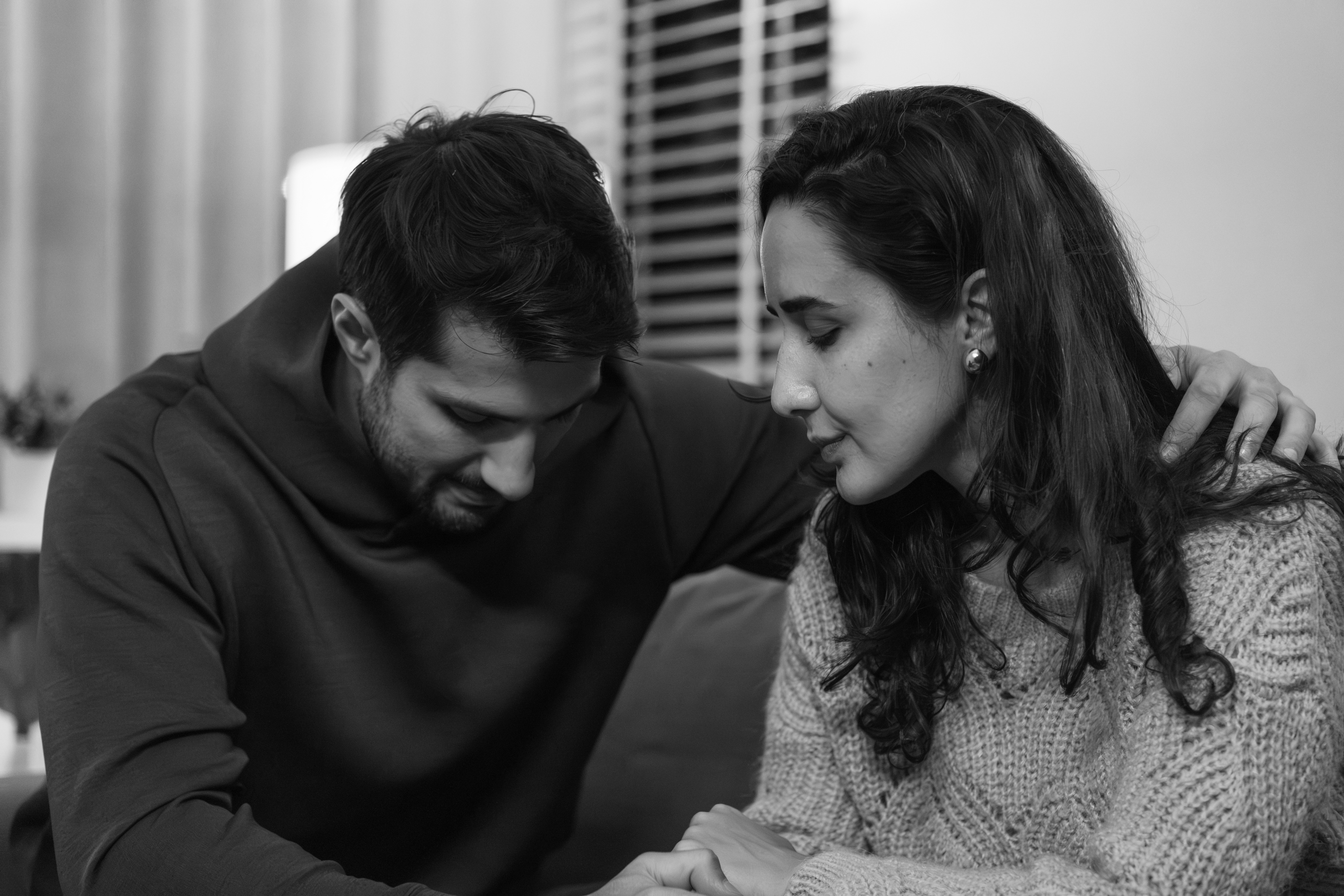 Couple supporting each other through the stress and emotion of their fertility journey