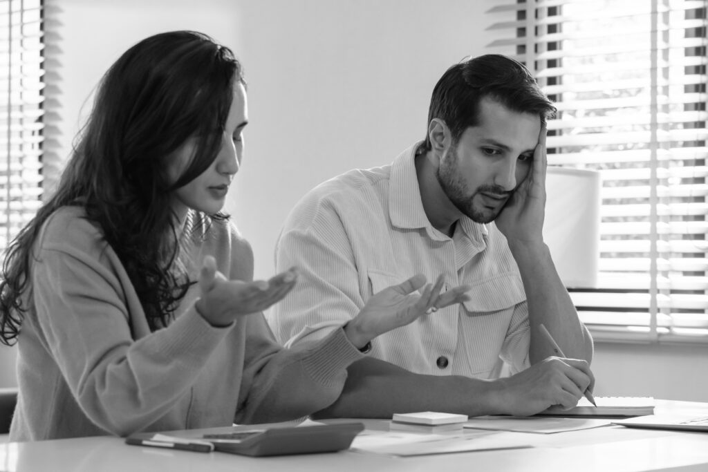 Stressed couple dealing with the financial pressure of IVF